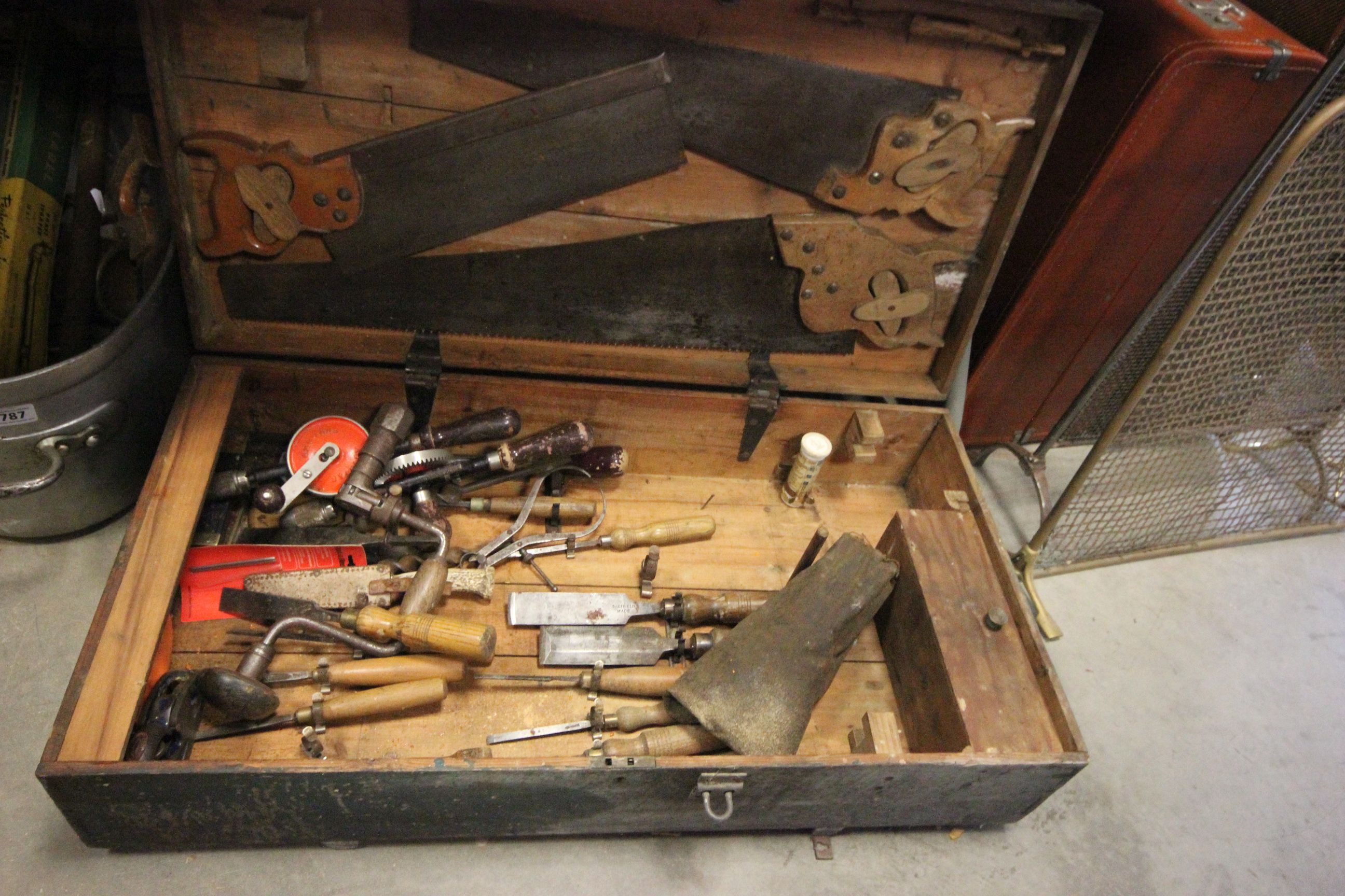 Wooden tool box trunk containing vintage tools