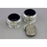 Silver cased vesta and a pair of silver salts with liners