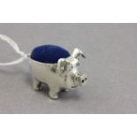 Silver pig pin cushion