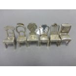 Set of White Metal Menu / Place Name Holders, each in the form of a different style chair