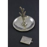 A silver stamp case, Chester 1912, along with a silver ring tree, Birmingham 1904