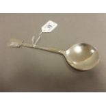 A silver table spoon, the reverse of the bowl with a hammered finish and 21cm long, Liberty & Co