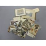 A collection postcards and photographs including military interest