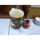 A Falcon Ware jug, decorated with a cavalier, model number 1801, along with Poole pottery vase