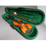 A modern cased violin by Antoni "debut" and one bow