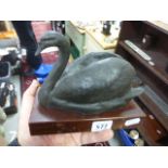 Bronzed swan on wooden base