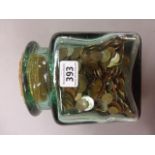 Glass jar of mixed world coinage