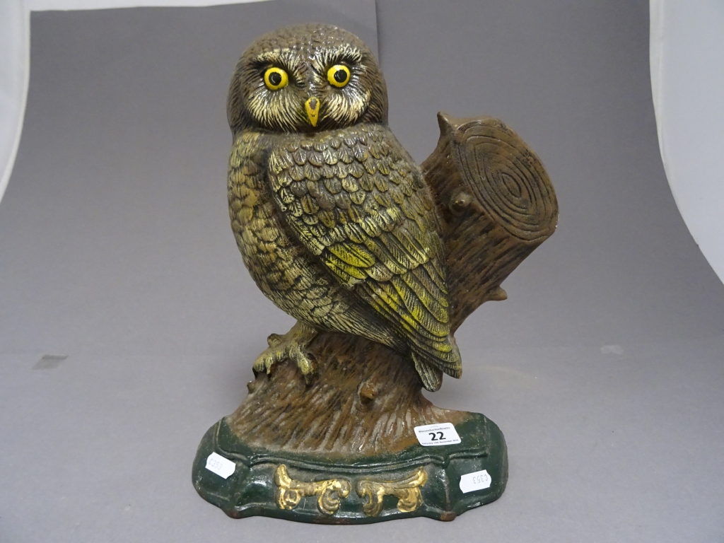 A painted cast iron door stop in the form of an owl