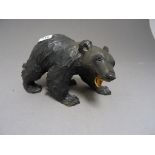 A carved wooden model of a bear