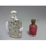 A white metal mounted scent bottle with a vacant cartouche , along with one other scent bottle