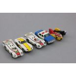 Four Matchbox PowerTrack slot cars plus a Britains Motorcycle BMW Racing Combination