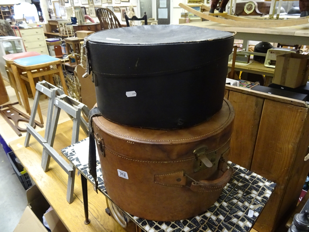 A leather hat box, plus one other hat box