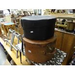 A leather hat box, plus one other hat box