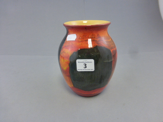 A decorative Poole pottery vase, printed marks