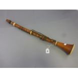 A wooden clarinet with ivory mounts by Dean & Company