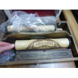 An oak cutlery box along with various music pianola rolls