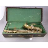 A saxophone in a fitted leather case, by Hawkes and Son