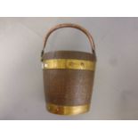 A vintage oak and brass bound bucket