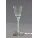 A 18th century wine glass, with white stem twist
