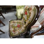 A Victorian spoon back chair, upholstered with a needlework fabric