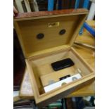 A Guy Janot humidor, with various accessories