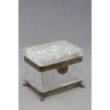 19th Century cut glass casket, with gilt metal mounts raised on paw feet