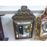 A brass framed bevelled mirror