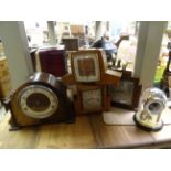 Four cased mantel clocks and one other clock