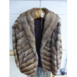 A ladies fur jacket by A.C. Edwards & Sons