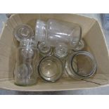 A collection of glass storage jars