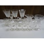 A Waterford cut glass jug, along with three Waterford glasses and a small collection of glassware