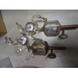 A pair of brass wall lights each with a bird finial, along with a pair of Brass Carriage Lamps