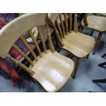 A set of four beechwood lath back kitchen chairs