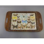 A vintage serving tray with butterflies