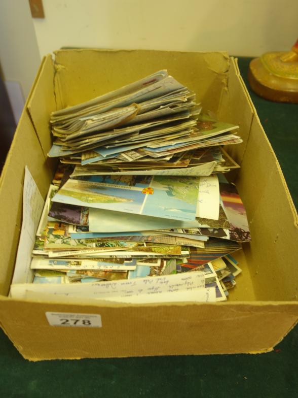 Box containing a large amount of old postcards,