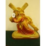 Painted chalk figurine of Jesus carrying the cross