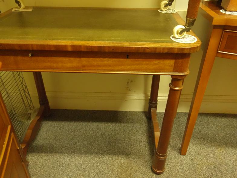 Regency period mahogany writing desk with a single flat drawer to the front on turned supports, 3'