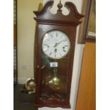 Antique style wall clock by Comitti of London Westminster chiming 8 day movement appears to be