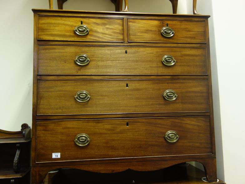 Regency chest of 2 short and 3 graduating long drawers with a shaped apron, mahogany