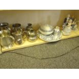 Shelf of collector’s items including pewter and china