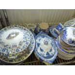 A shelf containing a large amount of blue and white dinner tea ware, inc Wedgewood a large amount