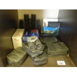 Shelf containing various Binoculars, all modern 10 items