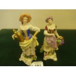 Dresden, a pair of 19c figurines of Flower Girls, each holding a basket of flowers both standing