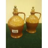 Unusual pair of Doulton stoneware Flagons each one decorated to the top section in an Arts &