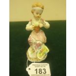 19th early 20 th Century Meissen, 4.1/4" tall Young Girl seated with fruit basket holding a Bird