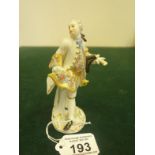 19th early 20 th Century Meissen, a figurine of a Dandy in a cream coat
