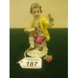 19th early 20 th Century Meissen, Seated Boy holding a single red rose, yellow jacket 3.5" tall