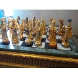 Stunning contemporary Chess set on marble base with gilt Empire Style Classical design, each of