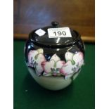 Contemporary Moorcroft vase and lid, dated 2009 to base brown Moorcroft printed mark, decorated to