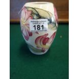 Magnolia coloured William Moorcroft vase c1999 with impressed marks and numbers to base, tube line
